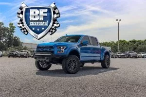 Side View Of A Blue Ford Super Duty With Bf Customs Logo O 300x200