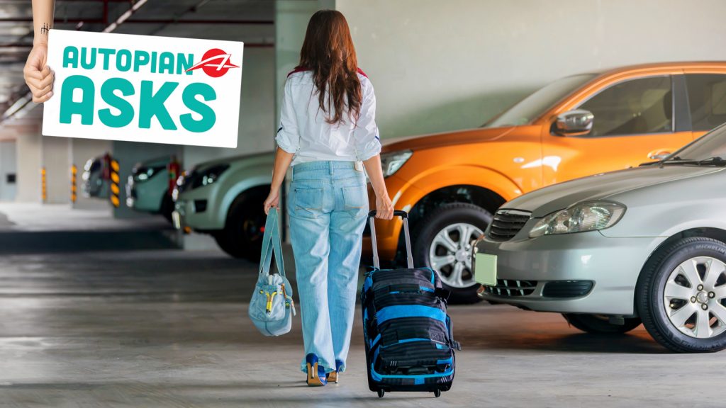Woman With Luggage Going To Her Car With Luggage.