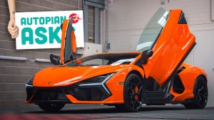 Orange Lamborghini Revuelto With Scissor Doors Open In Showroom
