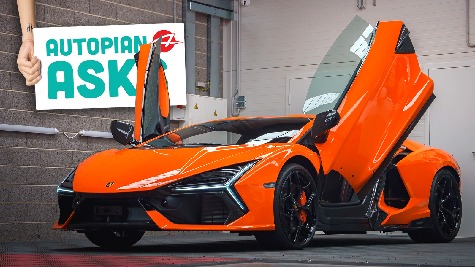 Orange Lamborghini Revuelto With Scissor Doors Open In Showroom