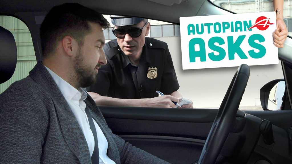 Policeman Stopping A Driver