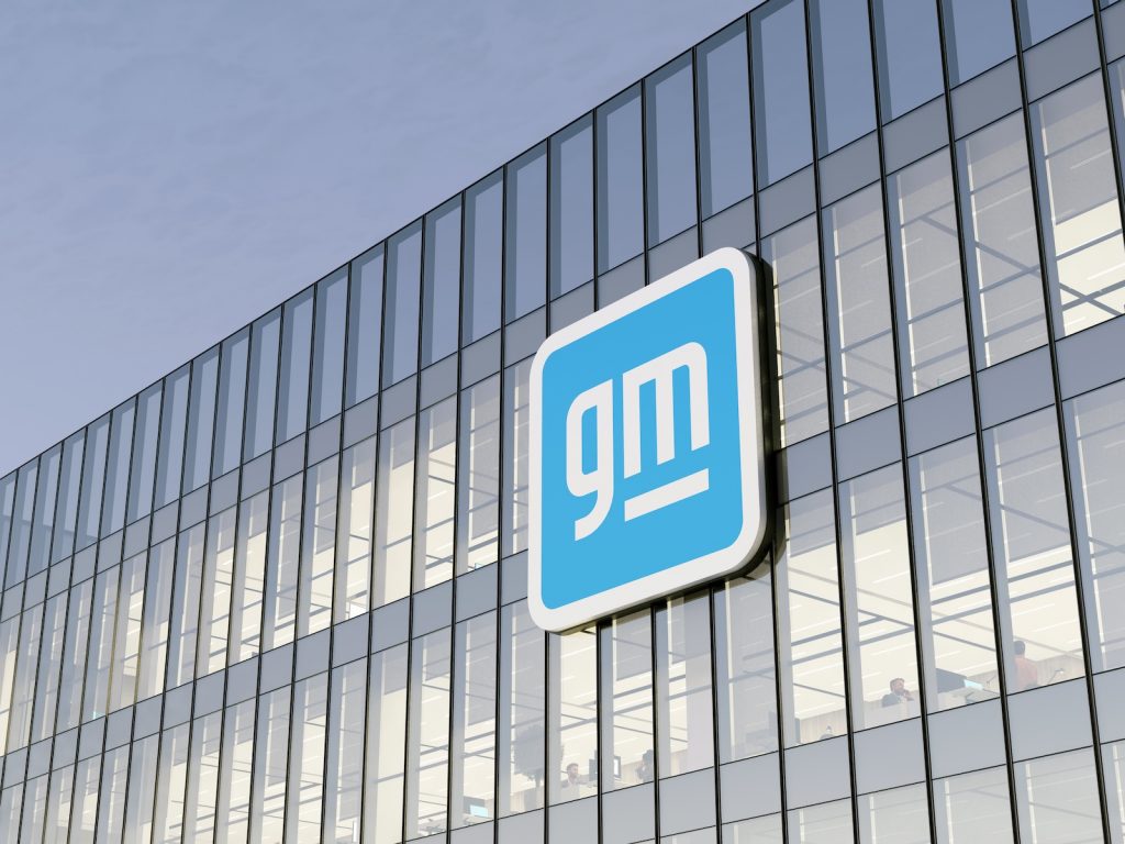 Detroit, Mi, Usa. May 2, 2022. Editorial Use Only, 3d Cgi. General Motors Company Signage Logo On Top Of Glass Building. Automobile Manufacturer In High Rise Office Headquarters.