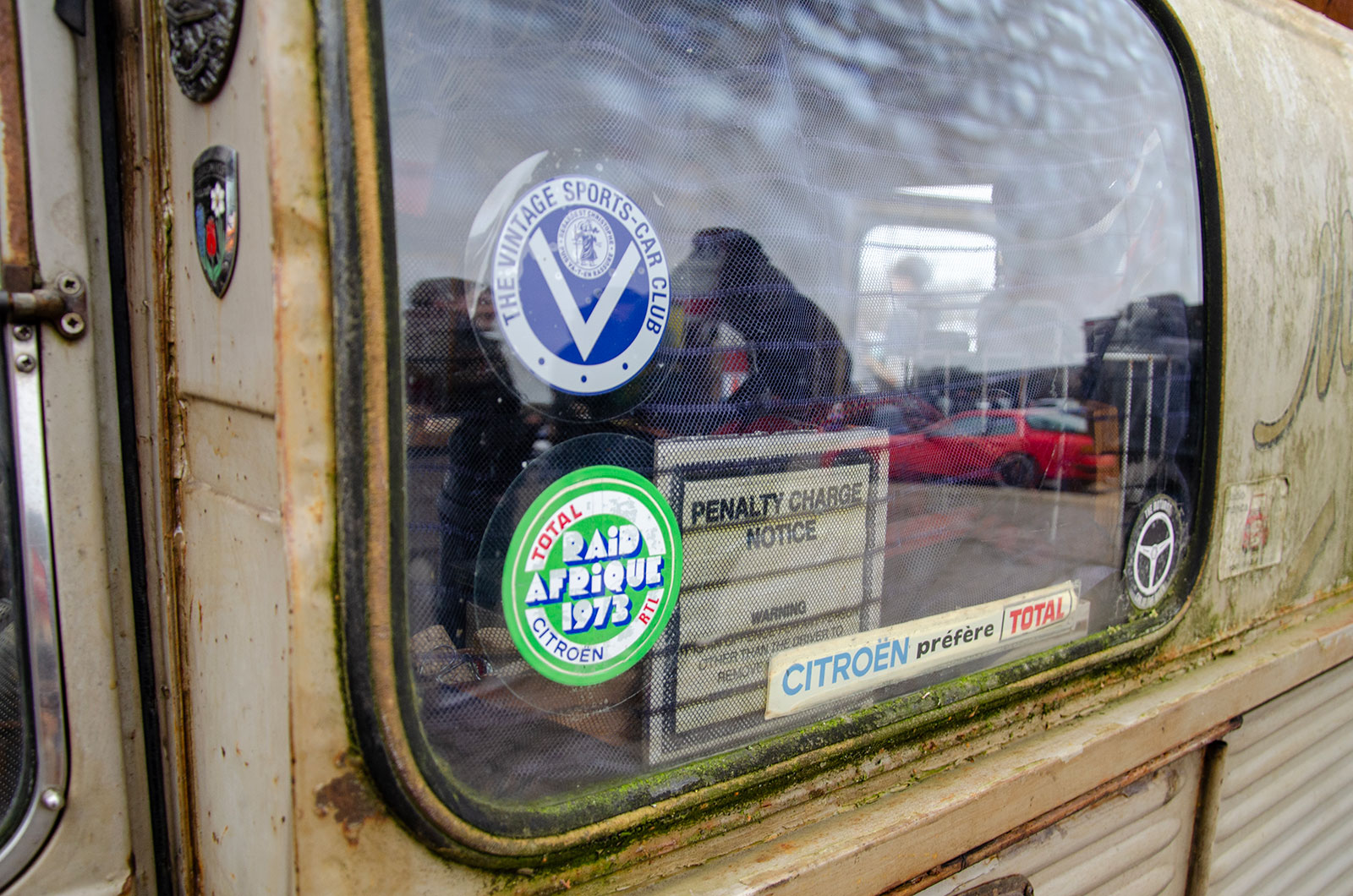 Citroen AK350 side window with a 1973 Raid Afrique sitcker