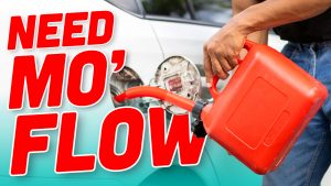 Young Man Holds Red Gallon Of Gasoline Which Is Reserve Gasoline