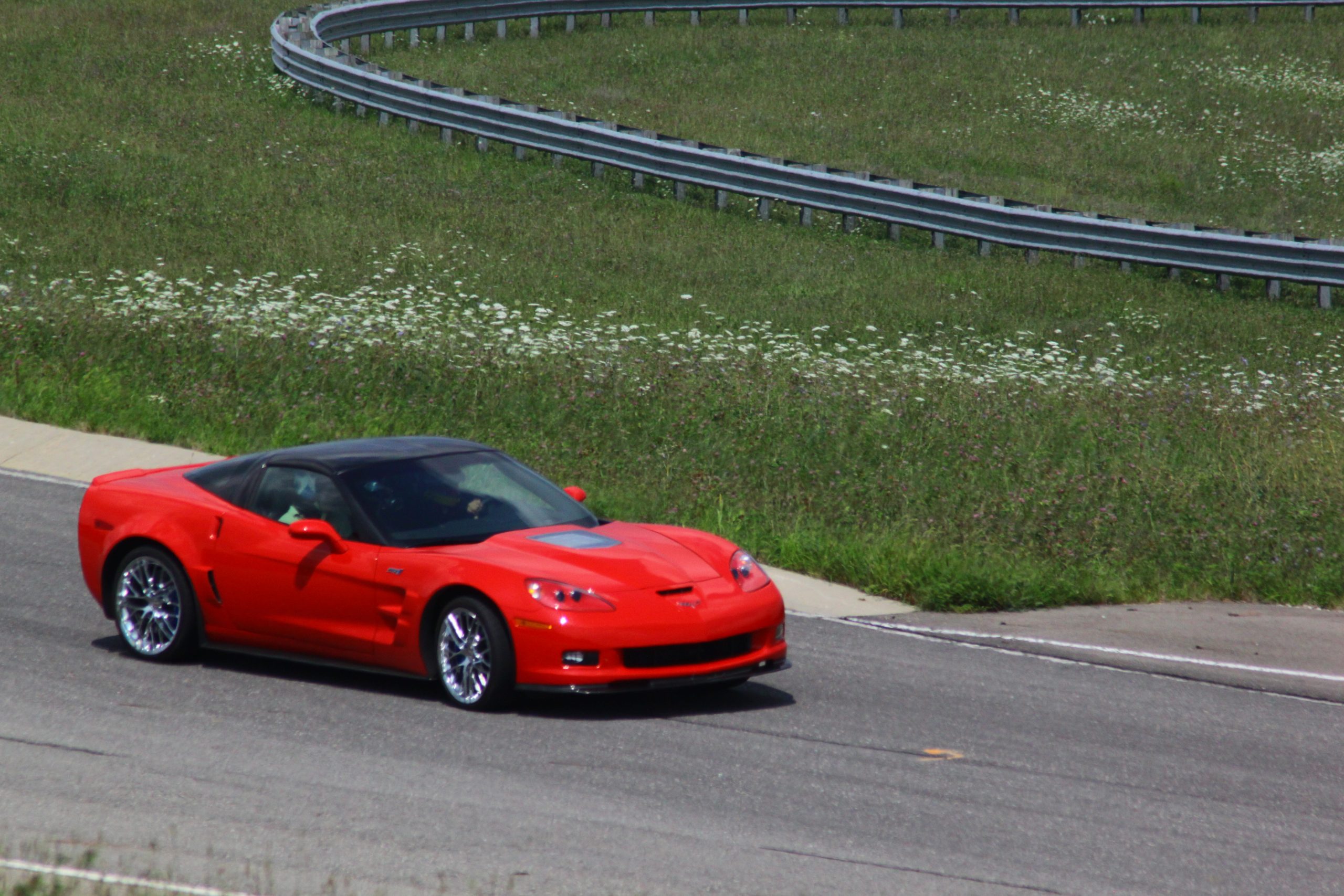 Juan Pablo Montoya flings the C6 Corvette ZR1 around the GM Milford Road Course in August 2010