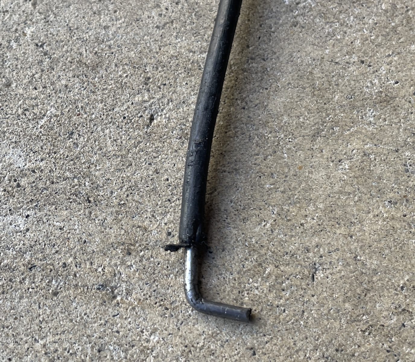 Bent coat hanger improvised tool