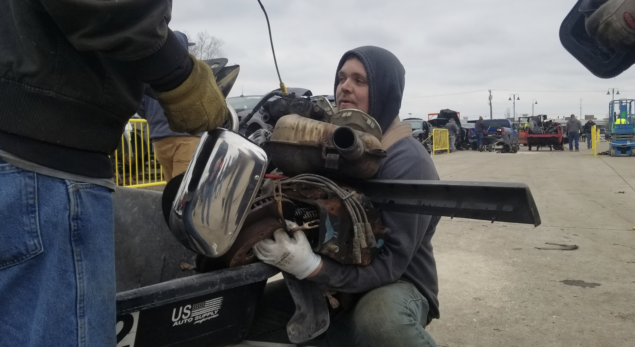 Watch In Awe As These Men Carry 300 Pound Engines And 500 Pound Axles On Their Backs To Save Money At A Junkyard - 90