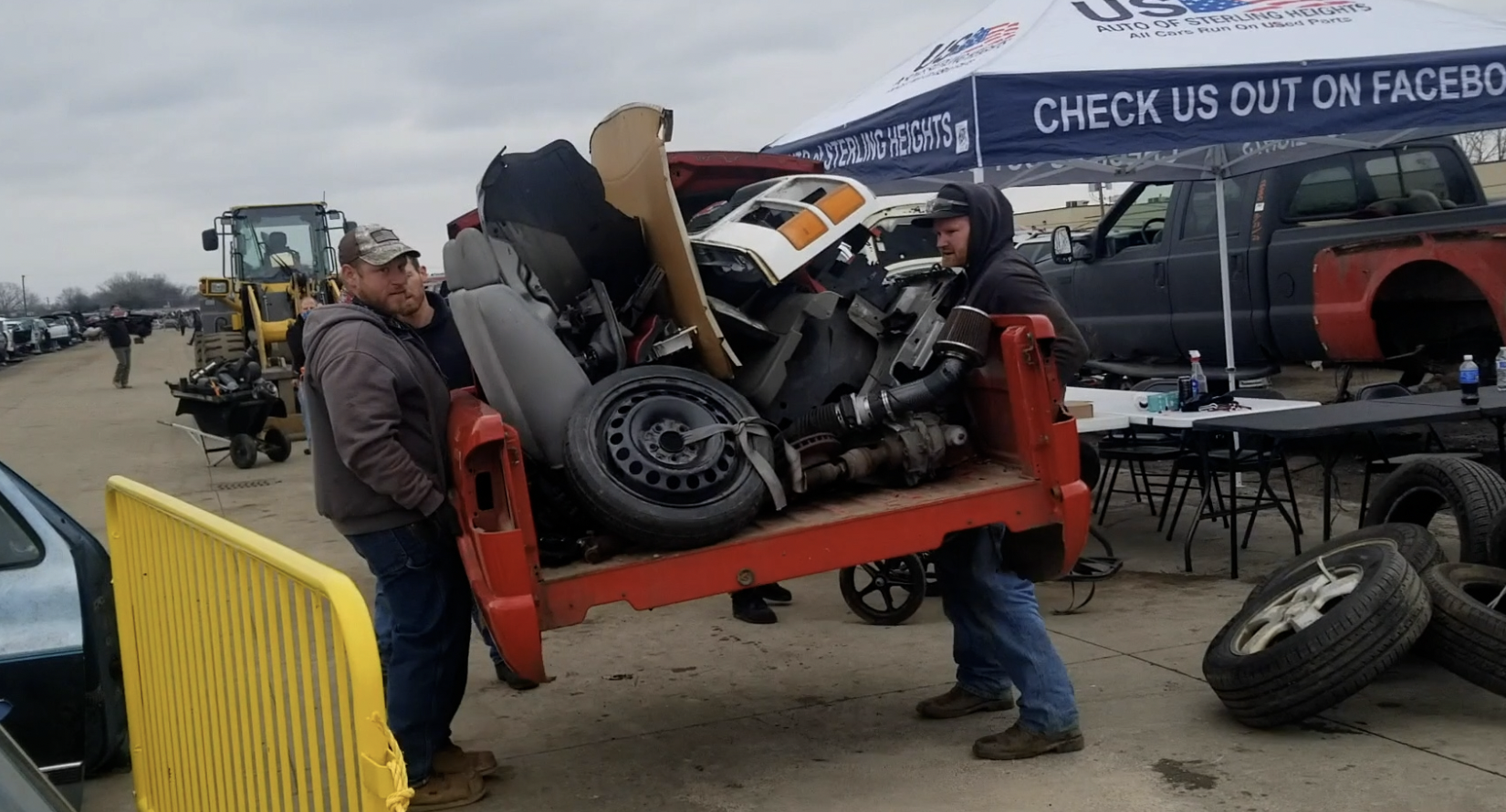 Watch In Awe As These Men Carry 300 Pound Engines And 500 Pound Axles On Their Backs To Save Money At A Junkyard - 98